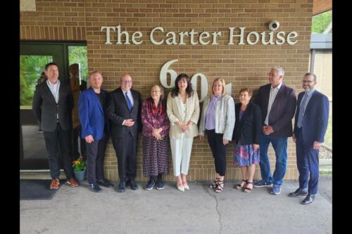 Government and Carter House officials pose for a group photo. Photo credit: Jon Perez